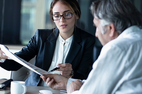 People reading paperwork